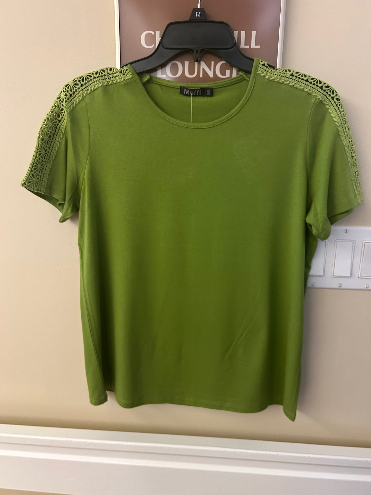 Short sleeve solid crewneck top with eyelet shoulder detail