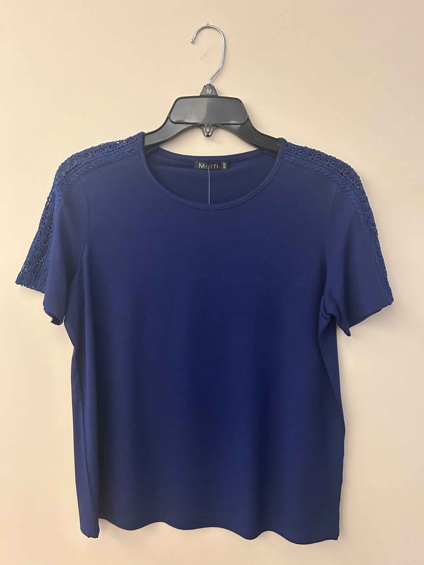 Short sleeve solid crewneck top with eyelet shoulder detail